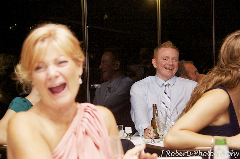Brother of the groom laughing at wedding speeches - wedding photography sydney